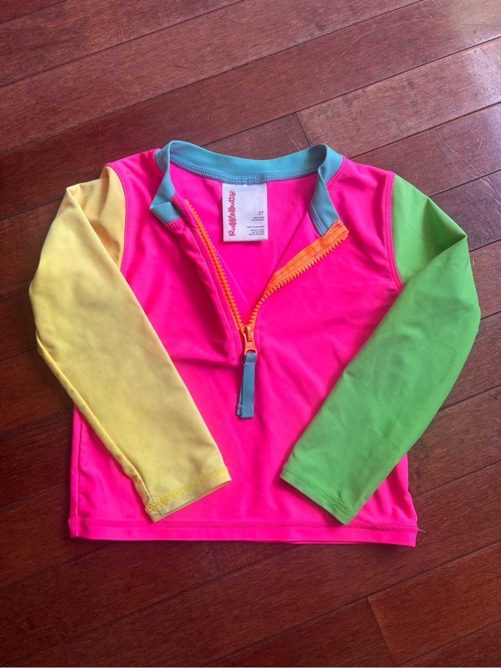 Ruffle Butts Neon Pink Rashguard with Yellow & Green Sleeves 3T